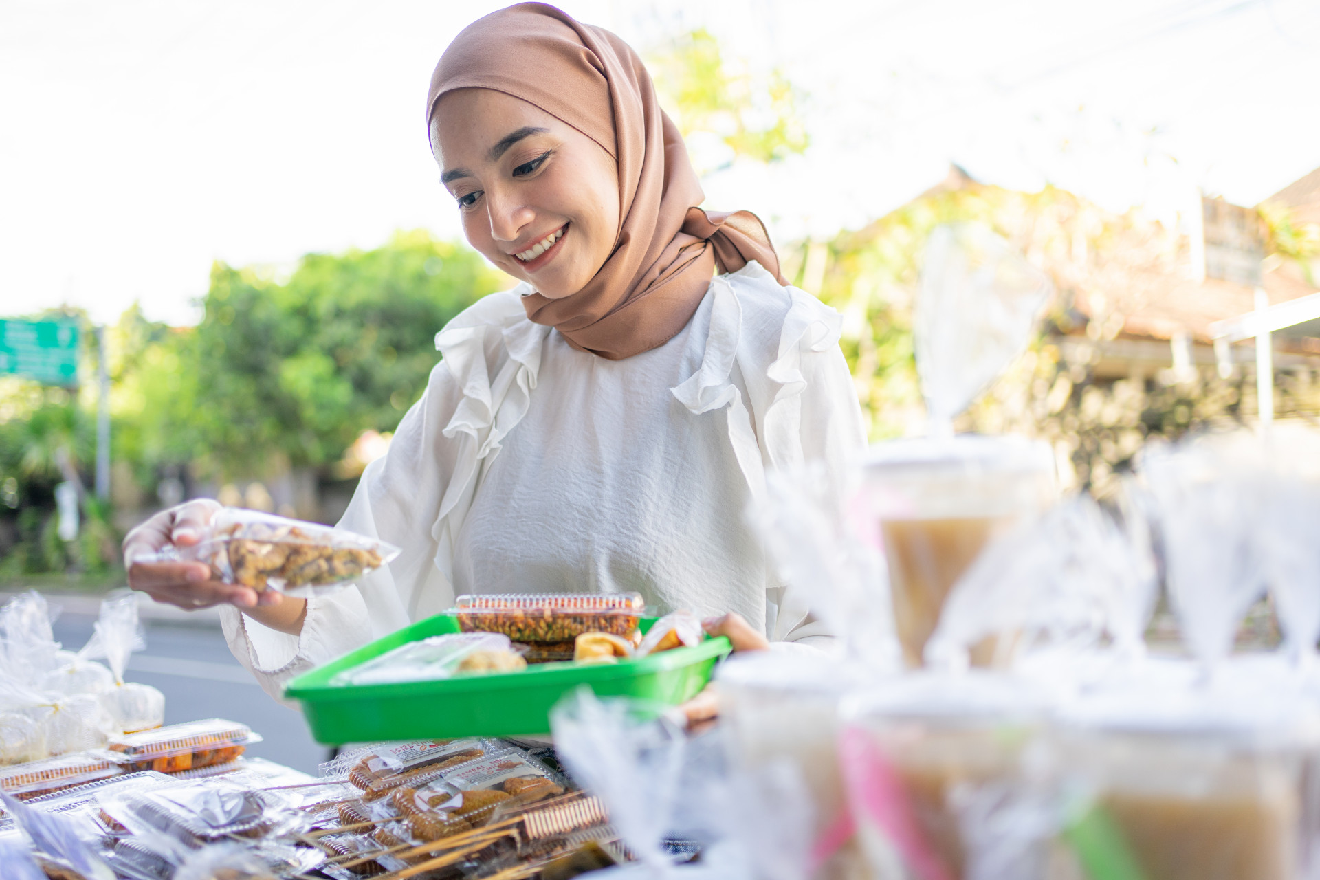 beautiful-girl-headscarf-holding-snack-wrapped-plastic-will-be-bought.jpg